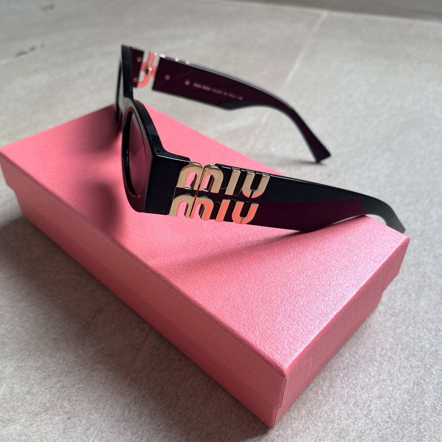Miu Miu Oval Sunglasses