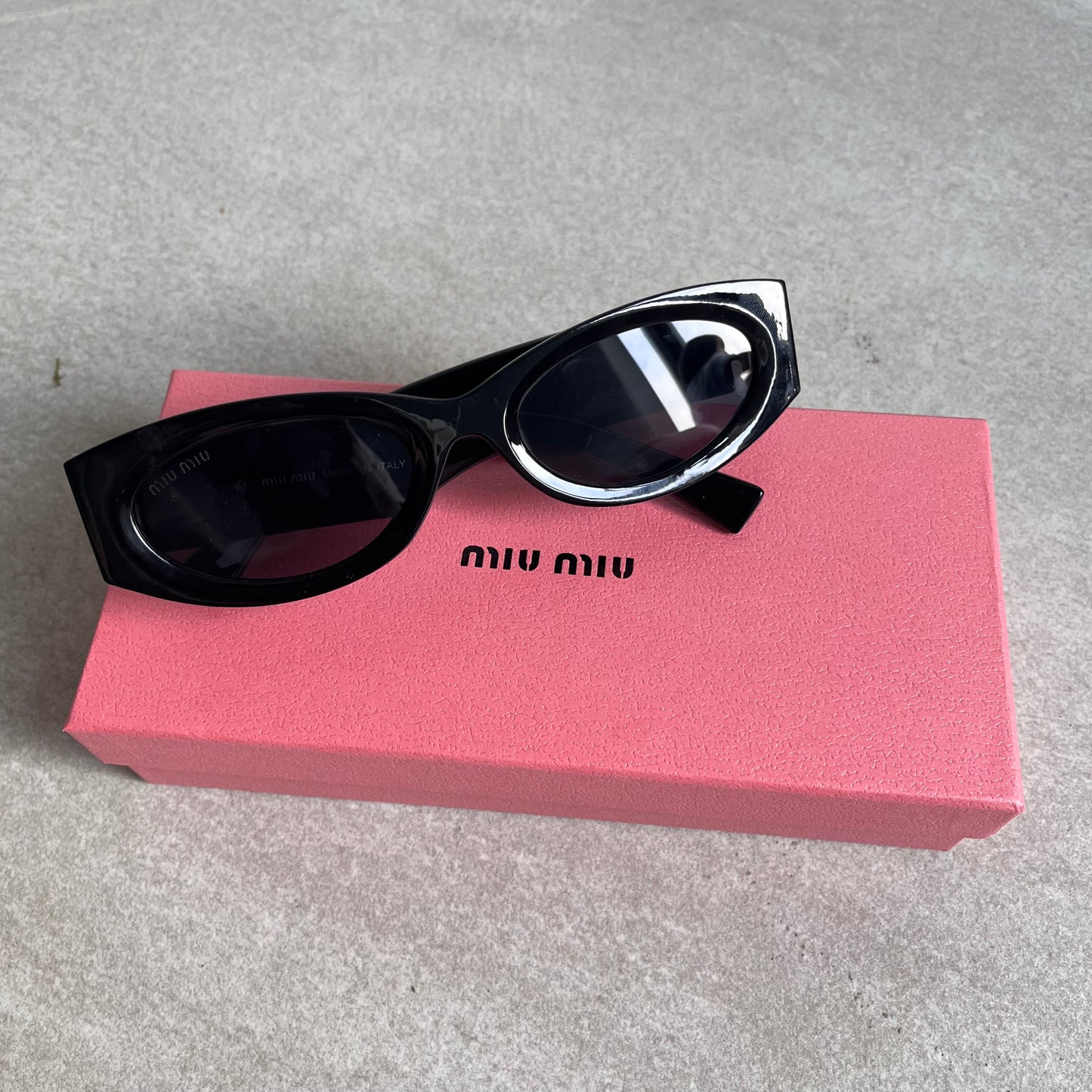 Miu Miu Oval Sunglasses