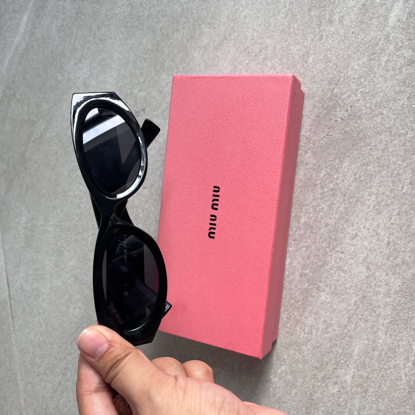 Miu Miu Oval Sunglasses