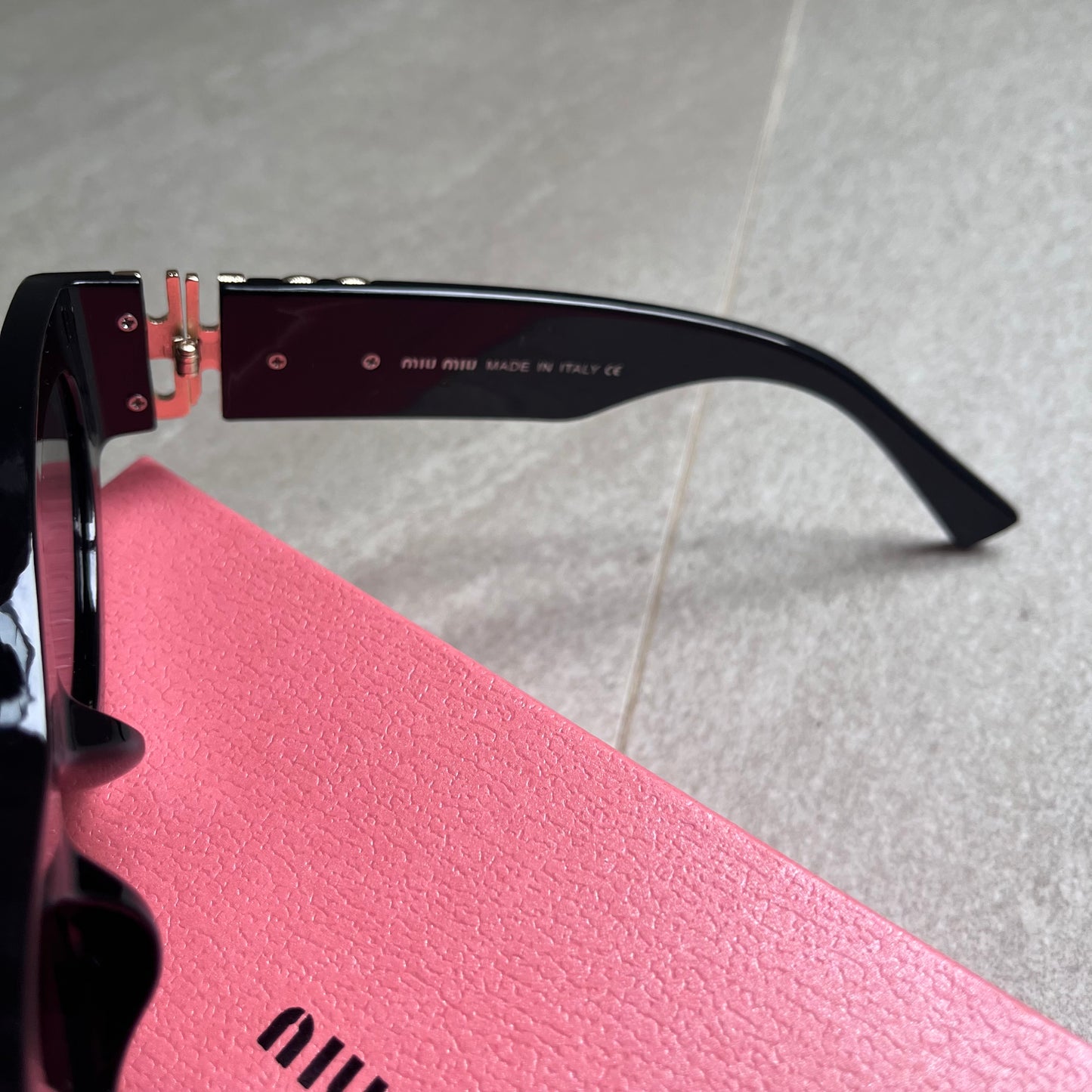 Miu Miu Oval Sunglasses