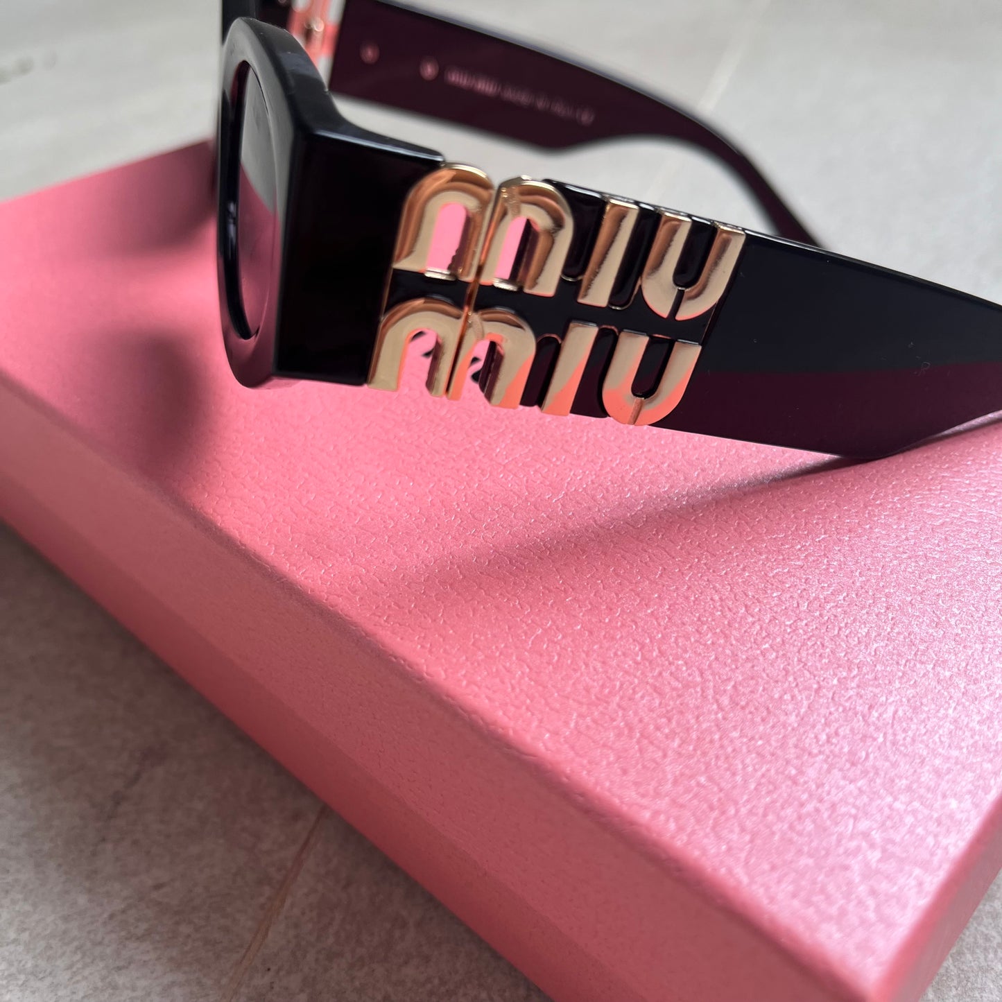 Miu Miu Oval Sunglasses