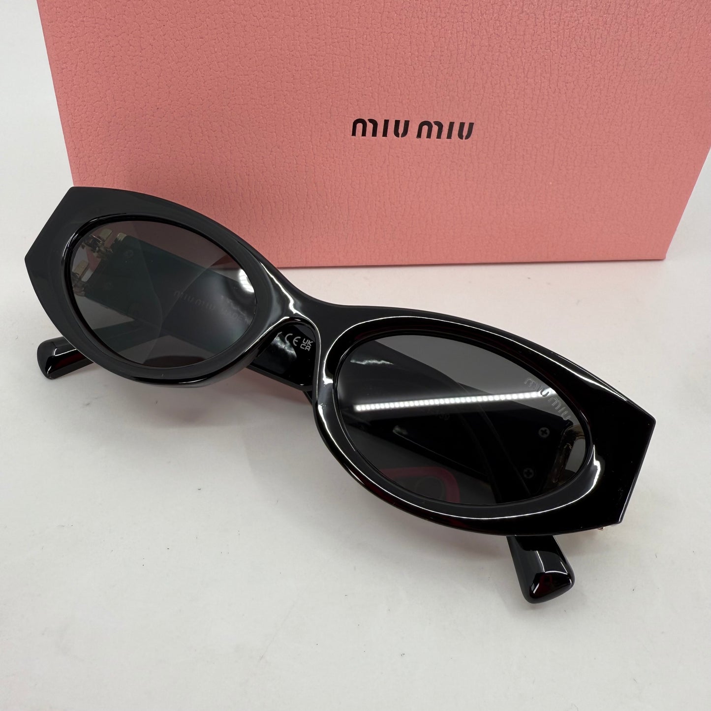 Miu Miu Oval Sunglasses
