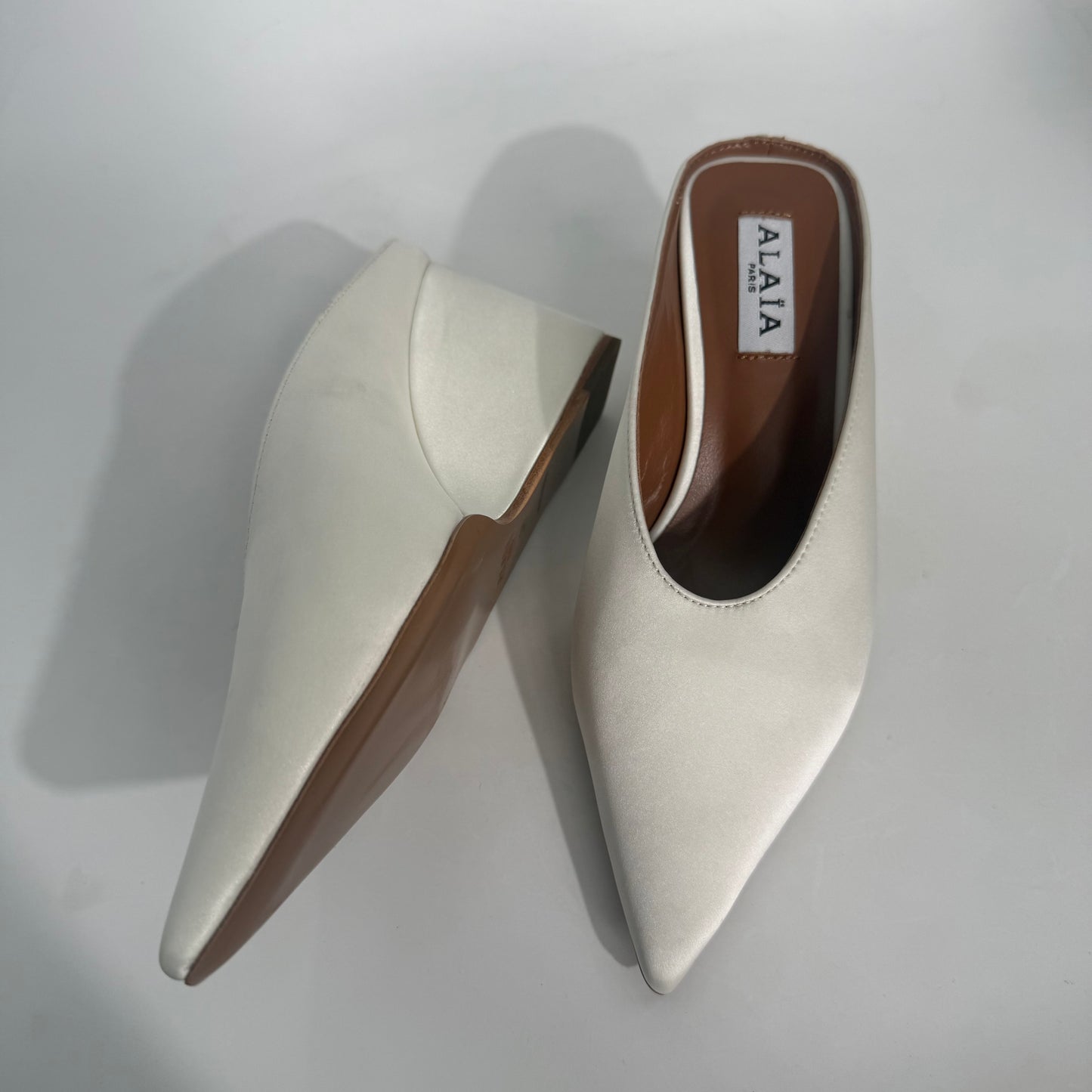 Alaïa White Staib Point-Toe Wedge Mules