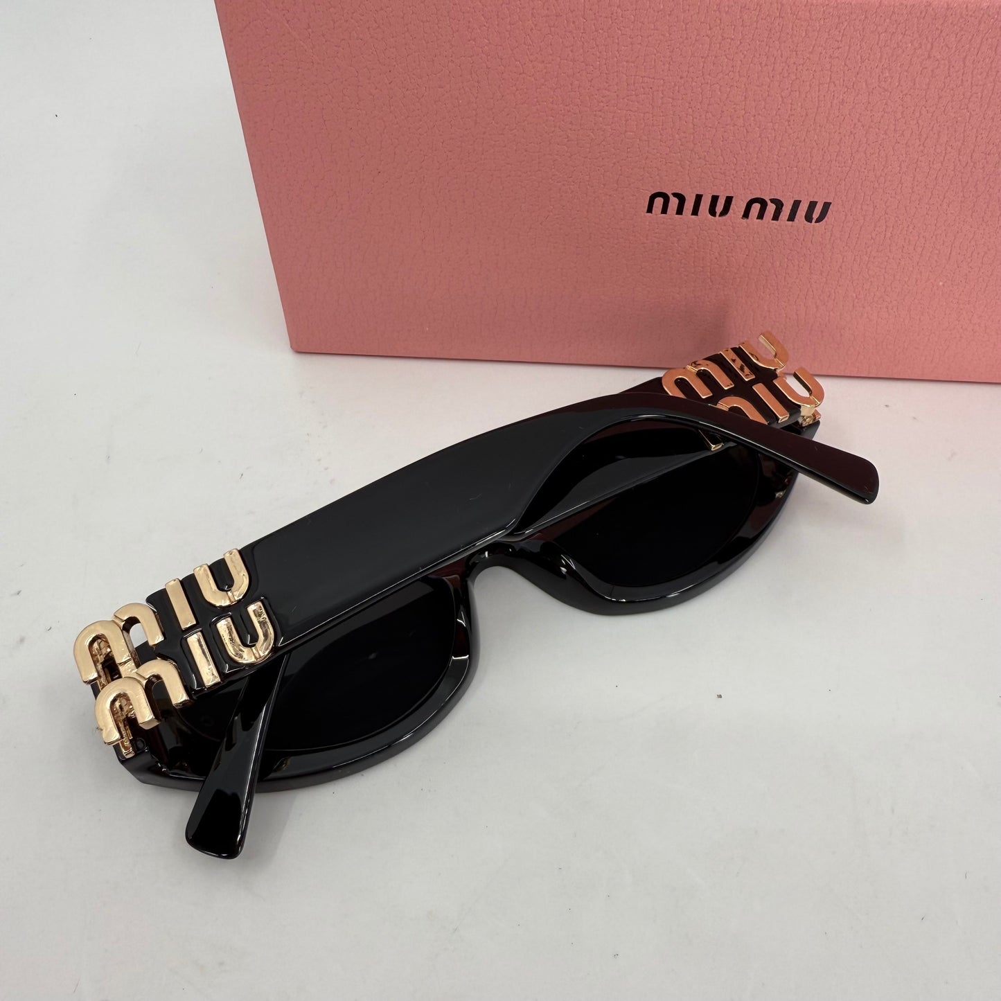 Miu Miu Oval Sunglasses