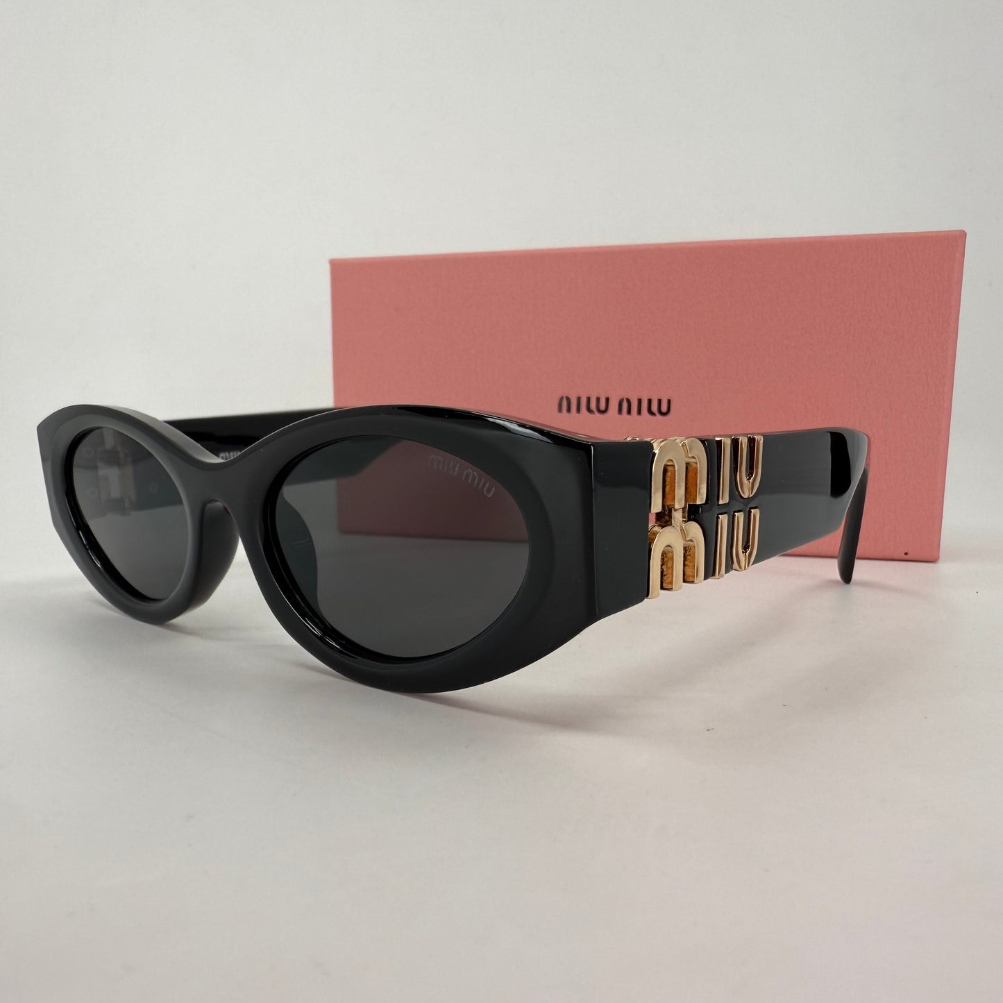 Miu Miu Oval Sunglasses